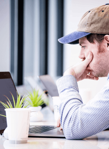 Employee looking intently at their computer